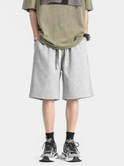 Men's light gray loose-fit casual shorts with a drawstring waist.