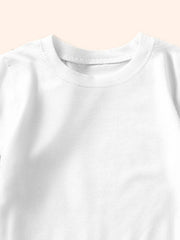 Close-up of the ribbed round neckline on a plain white children's T-shirt