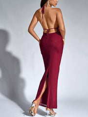 Back view of the dark red glitter halter neck bodycon maxi dress showing tie straps and slit