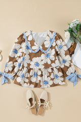 Blusa con mangas anudadas y estampado floral a rayas