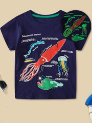 Dark navy children's t-shirt with colorful bioluminescent sea creatures print and glowing inset, front view