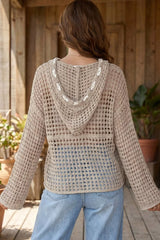Back view of mocha openwork crochet hooded cover up showing hood and drawstring details.