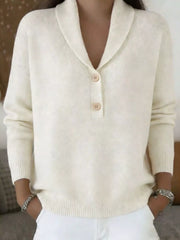 On-model front view of a cream shawl collar sweater with beige buttons