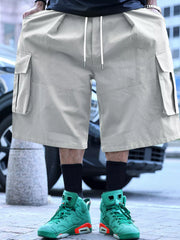 Men's light gray cargo shorts with a drawstring waist and pockets.