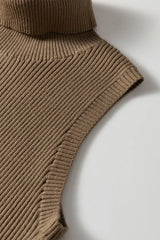 Close up of the mocha vest shoulder and ribbed armhole edge