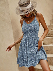 Women's deep teal floral mini cami dress with a V-neckline.