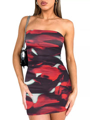 Model wearing a strapless deep red and black tie dye bodycon mini dress, front view