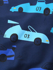 Close-up detail of the light blue racing car print on navy fabric
