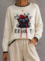 Beige cat sweater with black cat graphic and red hood strings