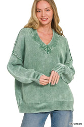 Front view of a dark green washed oversized sweater with a deep V neckline