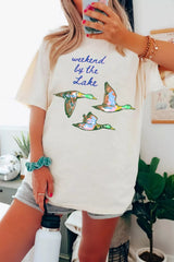 Front view of oversized white T-shirt featuring “weekend by the Lake” text and three colorful ducks.
