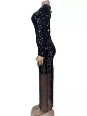 Side view of black asymmetrical dress on a mannequin showing rhinestone panel