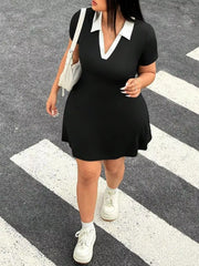 Full front view of black plus size mini dress with white contrast collar walking