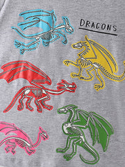 Close-up of the colorful blue, yellow, red, green and pink dragon skeleton prints on a gray children's T-shirt