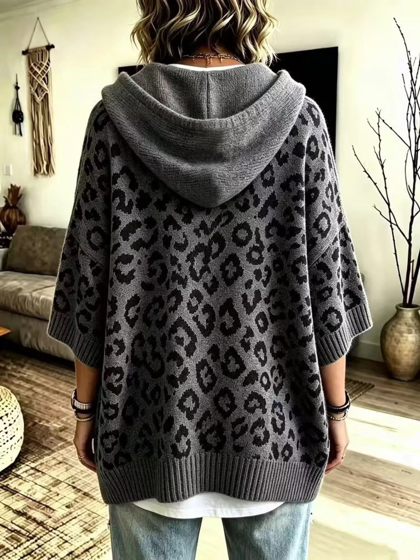 Back view of gray leopard print oversized hooded knit sweater with solid gray hood