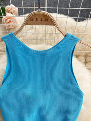 Close view of bright blue ribbed knit bodice with scoop neckline on hanger