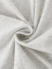 Close view of the soft twisted light gray cotton fabric texture of the children's T-shirt