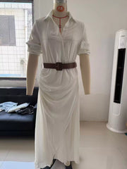 Front view of a white shirt maxi dress on a mannequin with a brown belt and draped skirt