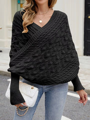 Front view of black cable knit batwing sweater with V neckline and leaf pattern.