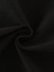 Close view of the soft twisted black knit fabric texture of the children's T-shirt