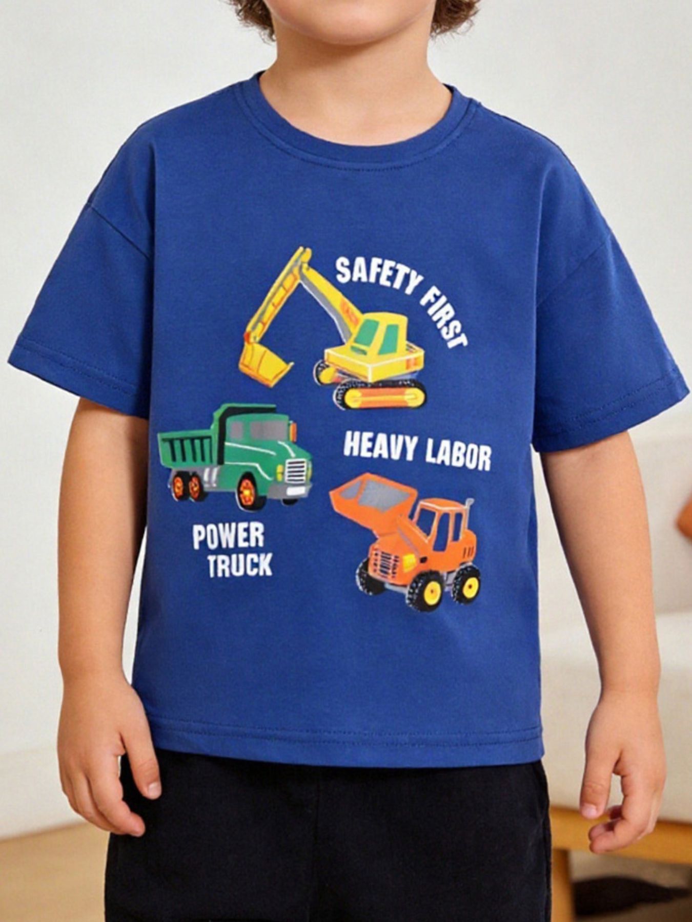 Front view of a navy children's tee with a yellow excavator, green truck and orange loader graphic