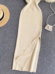 Lower skirt of cream white ribbed knit midi dress showing side slit detail