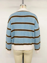 Back view of striped blue polo sweater on a mannequin, with cream collar and hem.