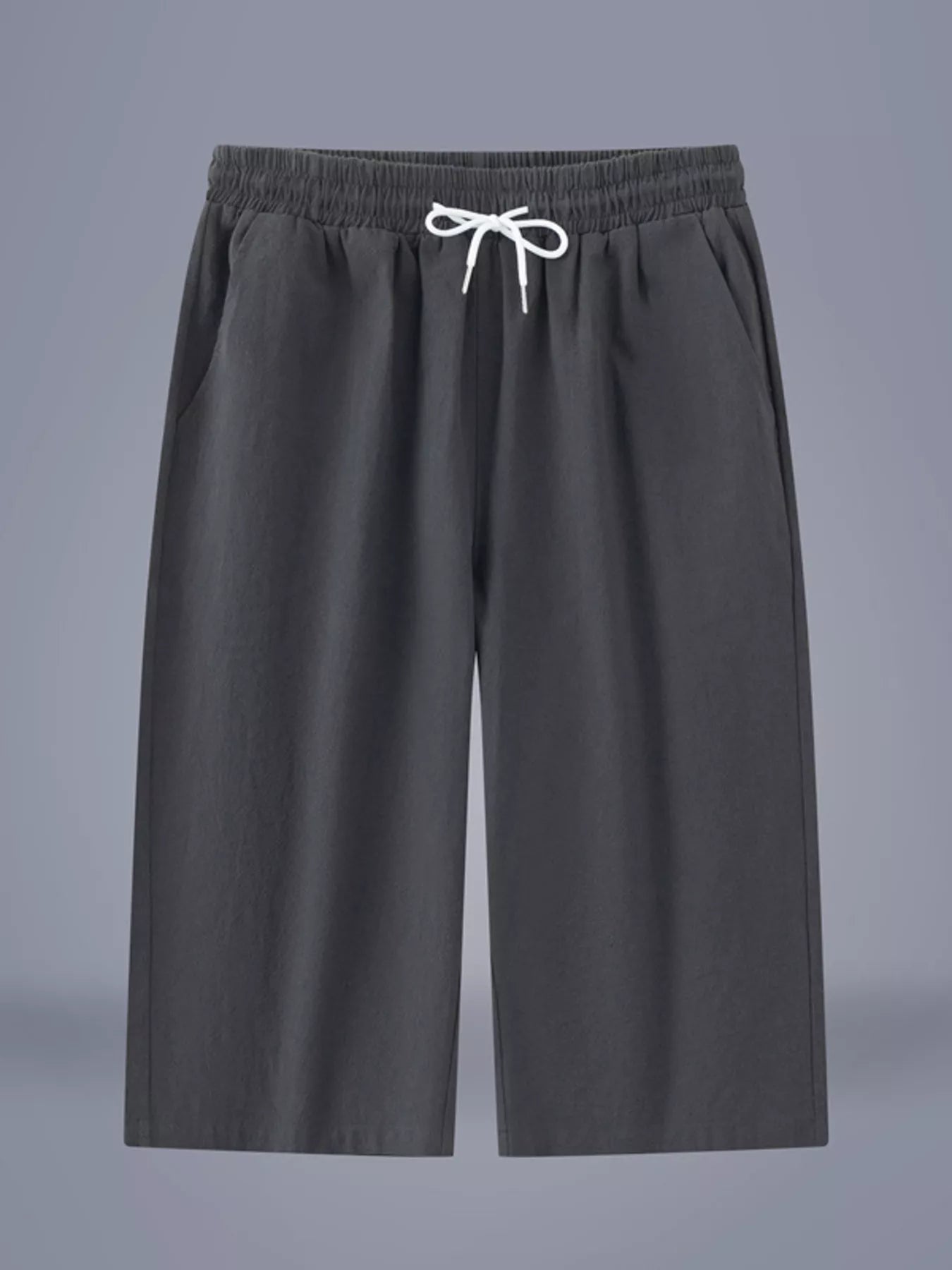Men's dark gray cropped casual pants with a drawstring waist and pockets.