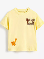 Flat lay front view of a pale yellow children's tee with small dinosaur valley lettering and a small orange dinosaur