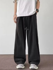 Men's black loose-fit casual cargo pants with a drawstring waist and pockets.