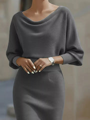 Close view of the gray cowl neck and three quarter sleeves on a bodycon midi dress