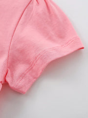 Close view of the short puff sleeve hem and stitching on the blush pink children's T-shirt