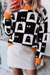 Mirror front view of a black and white ghost checkerboard sweater with orange cuffs