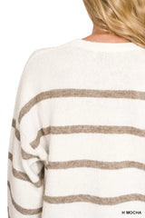 Close back view of cream striped sweater with mocha stripes and round neckline.