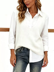 White V neck sleeveless knit sweater vest layered over white collared shirt, front view