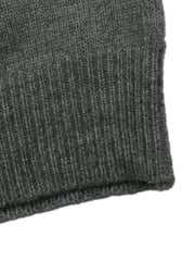 Close up of dark grey sweater ribbed hem and knit texture flat lay