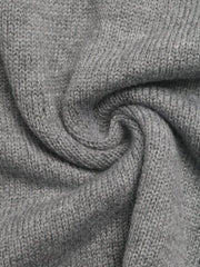 Close up of the soft gray knit fabric showing its fine texture and drape