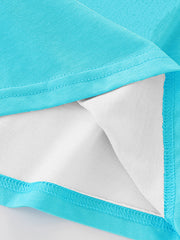 Detail view of the folded hem and white inner lining on a children's pastel blue short sleeve t-shirt