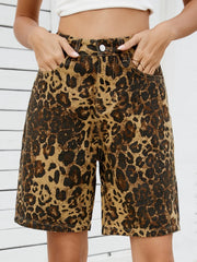 Women's leopard-print denim shorts with a high waist and pockets.