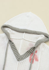 Top de punto con capucha y flores con cordón