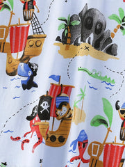Close-up detail of the pirate ship, skull island, and treasure map print on light blue fabric