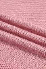 Close up of the dusty pink knit fabric showing its soft textured weave