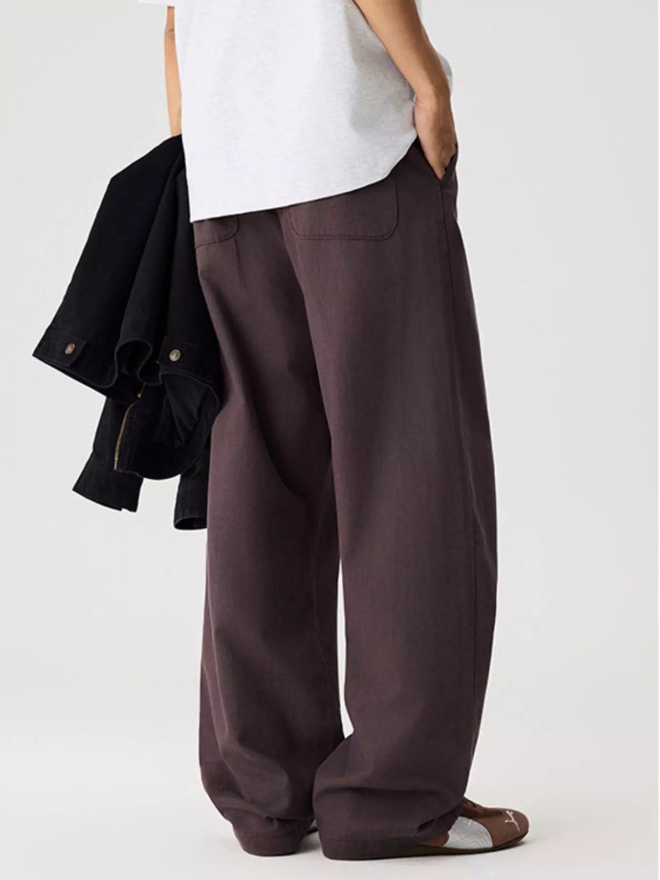 Men's relaxed fit pants with a drawstring waist and pockets.