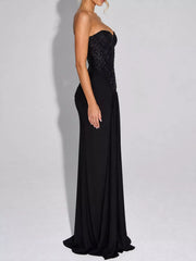 Black strapless sequin corset maxi dress on model, full length side profile in studio