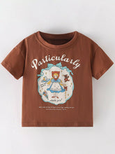 Front view of dark brown children's short sleeve tee with cartoon girl and teddy bear graphic