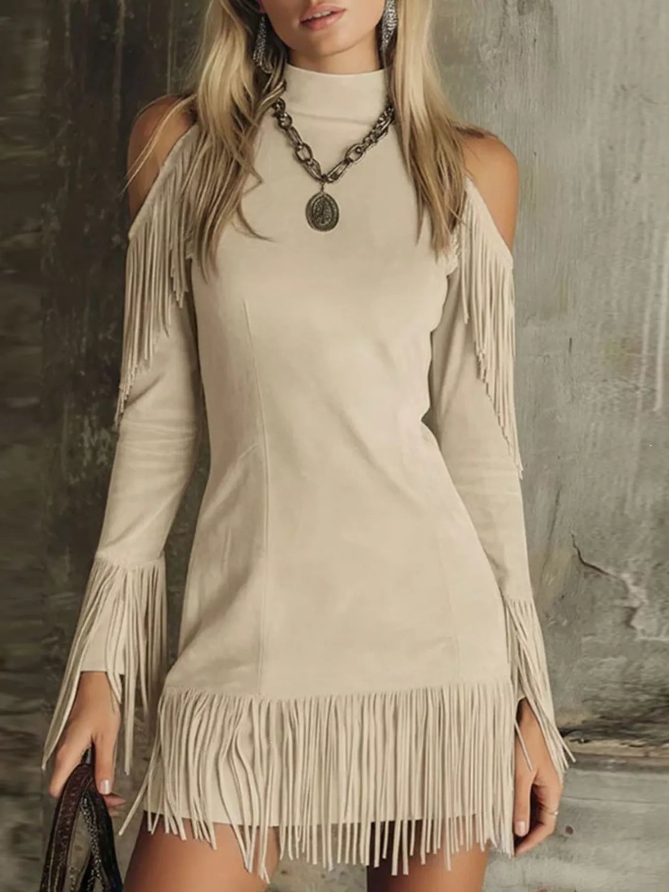 Apricot fringed cold shoulder mini dress worn front with long sleeves and fringe hem
