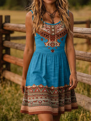 Blue sleeveless tribal print summer dress with patterned bodice and hem front view
