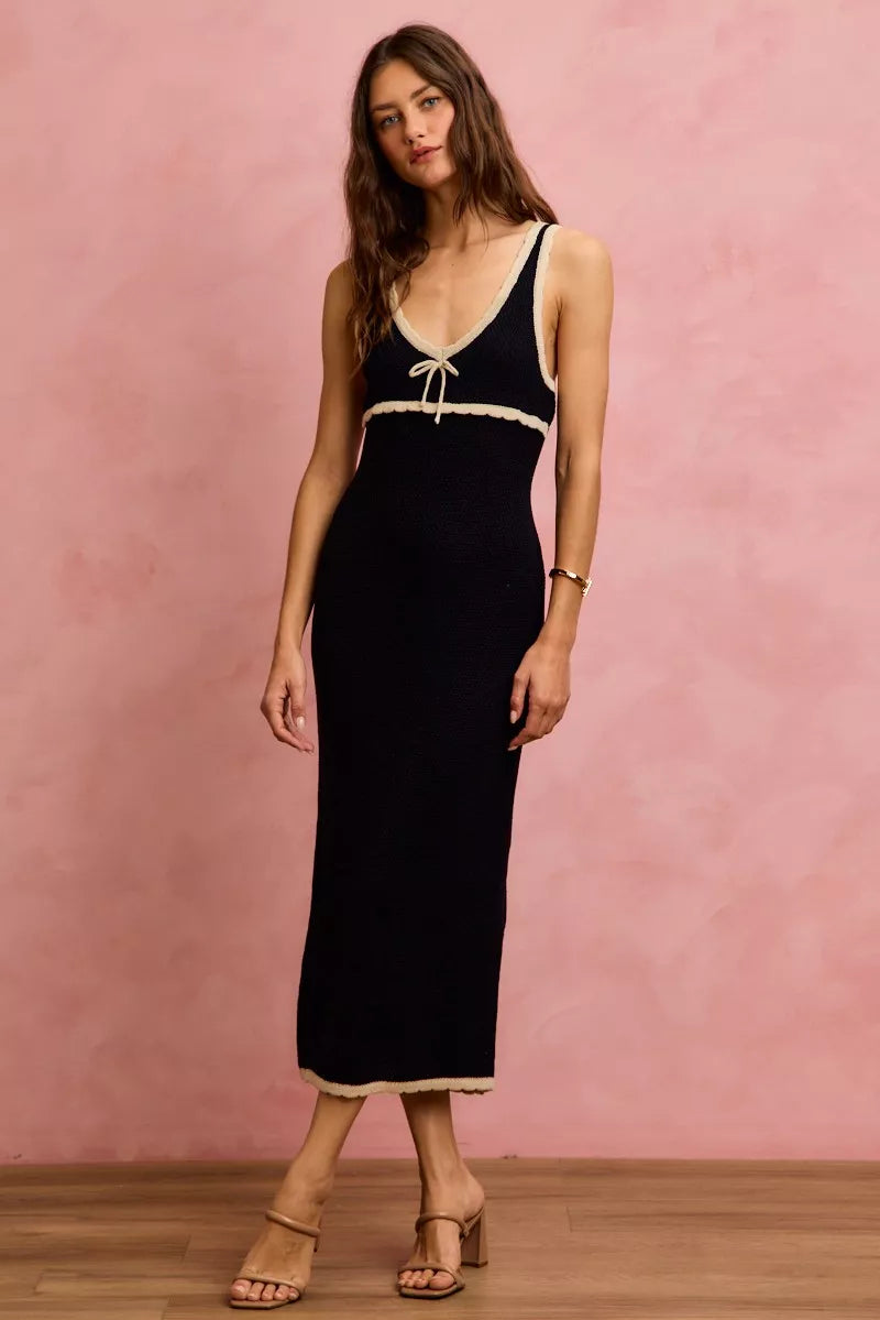 Black and oatmeal sleeveless knit sweater maxi dress in front view with relaxed pose