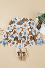 Blusa con mangas anudadas y estampado floral a rayas