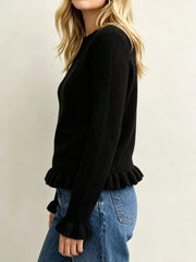 Side view on-model of black crew neck sweater with ruffled hem and cuffs